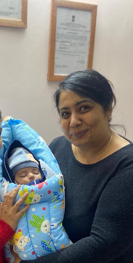 Sweet Dreams: Sleeping Newborn in Carrier Pouch