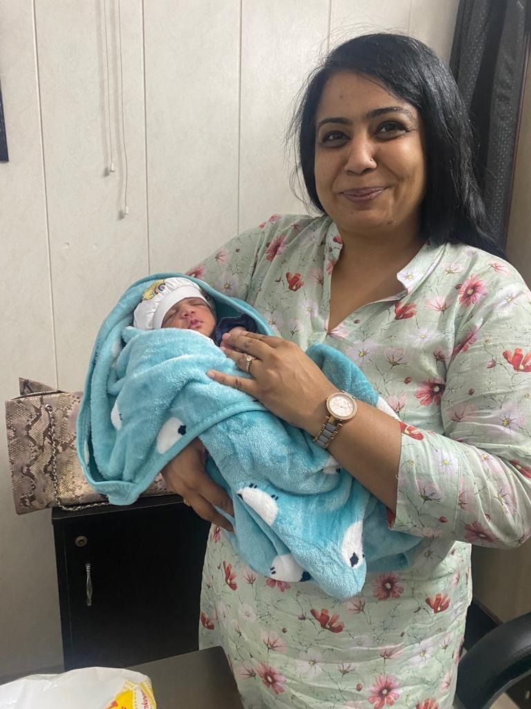 Peaceful Newborn Sleep in Caring Arms